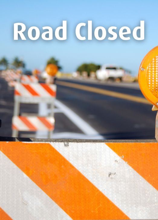 Road closure sign with headline: Road Closed