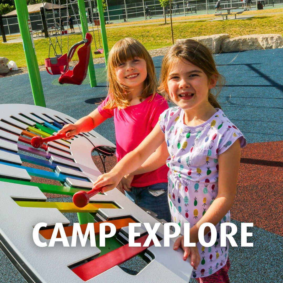 Two girls playing on playground equipment Text: Camp Explore