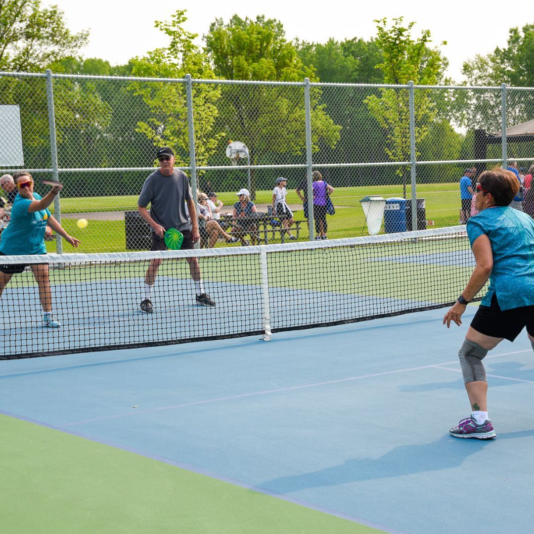 Four players playing pickleball at Red Oak park