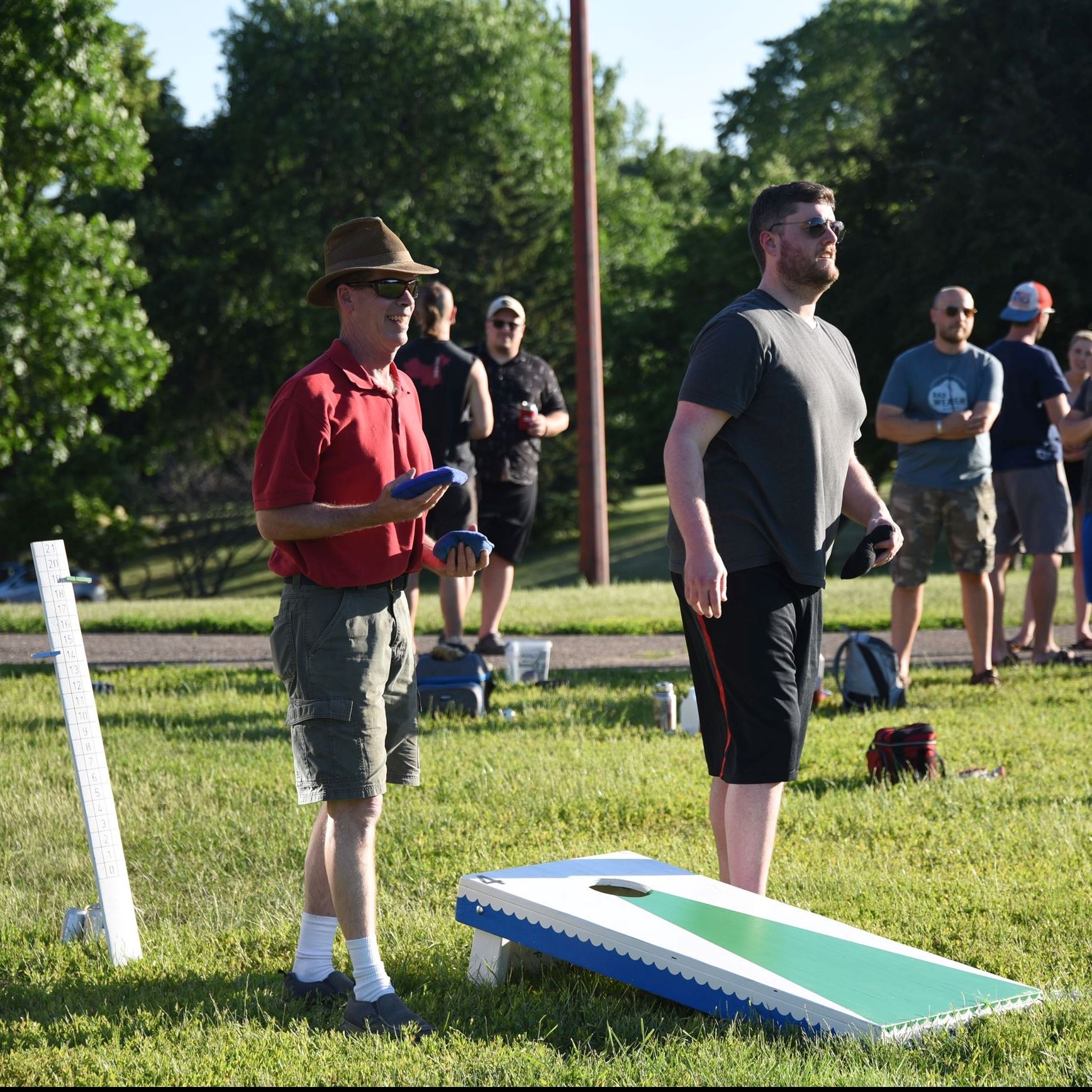 bean bag players waiting their turn 