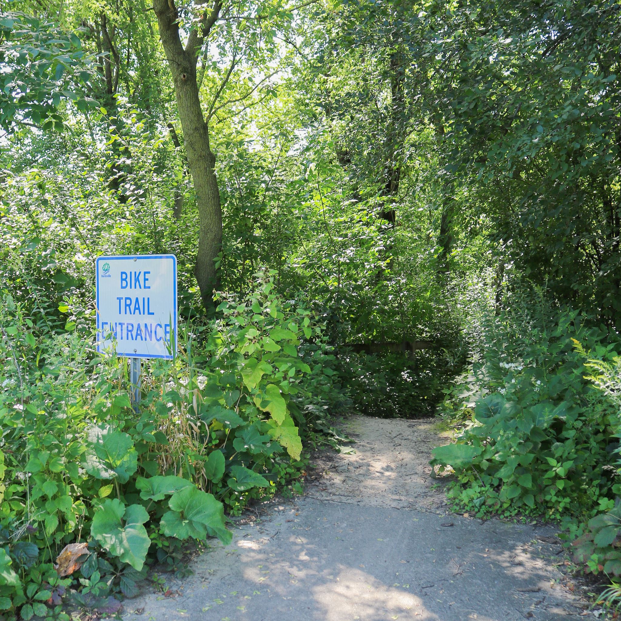 Mountain bike trail entrance with sign
