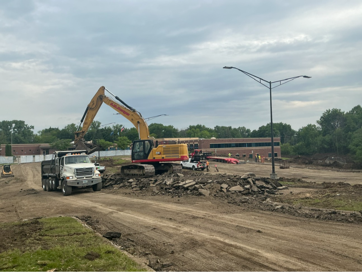 Removing asphalt from city hall parking lot